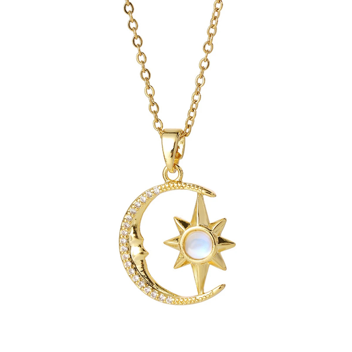Gold necklace with moon and star pendant on a white background