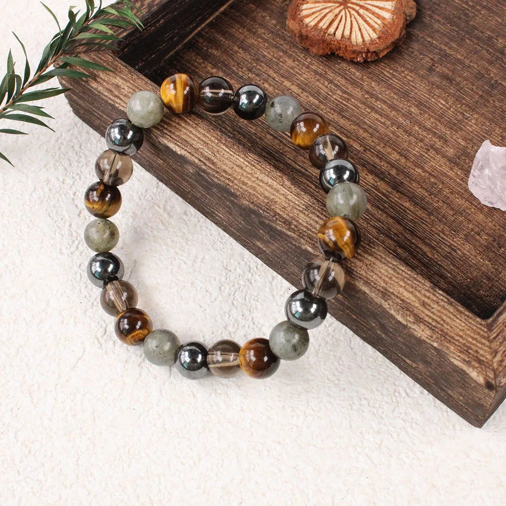 Beaded bracelet on a wooden block with a white background