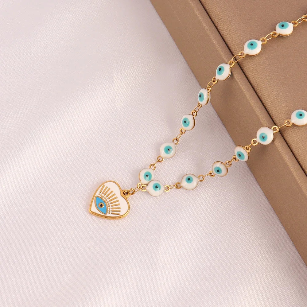 Close up blue evil eye charm pendant necklace detail stainless steel