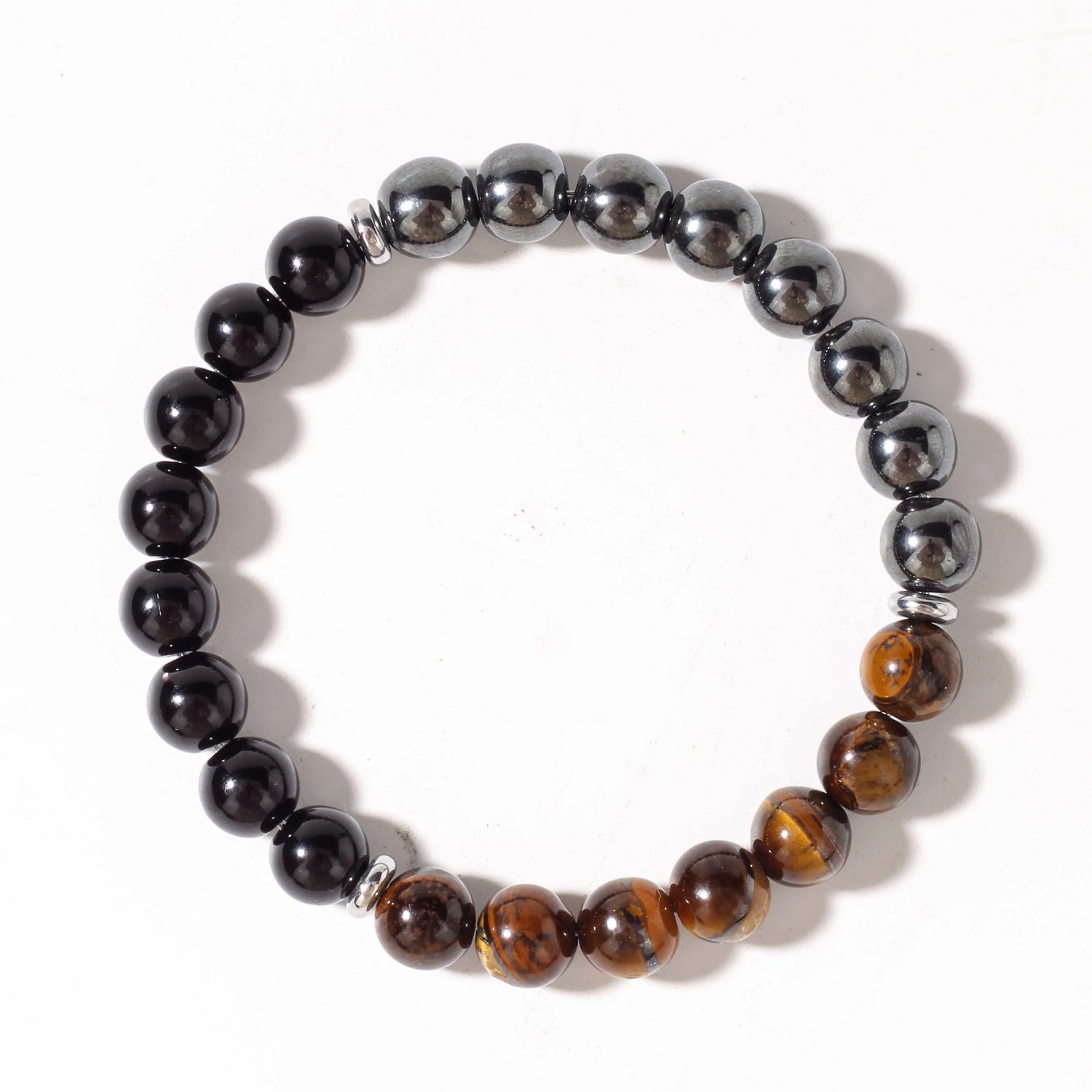Beaded bracelet with black, brown, and silver beads on a white background